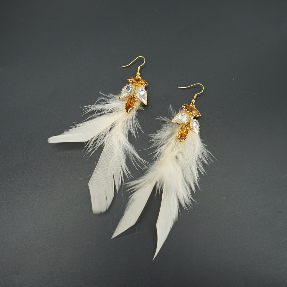 Boucles d’oreilles avec plumes doré et cristaux